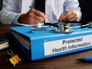 Notebook binder that says "protected health care information"