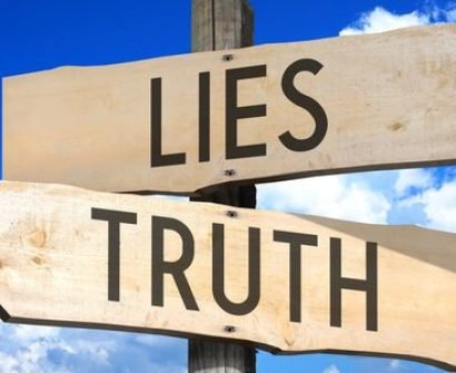 A wooden sign that says lies and truth