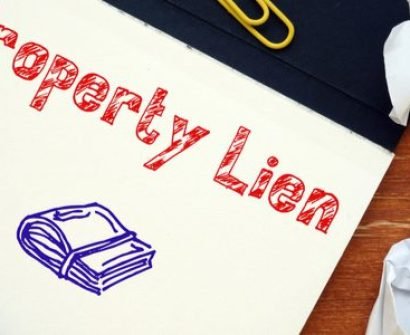 A paper with the words property lien written on it.