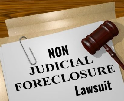 A judge 's gavel on top of a non judicial foreclosure lawsuit.